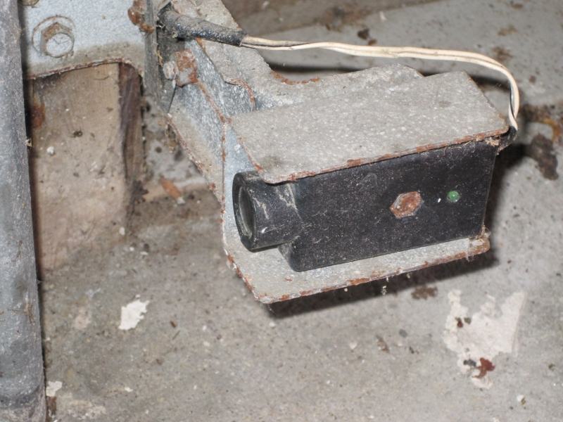 Corroded garage door safety sensor