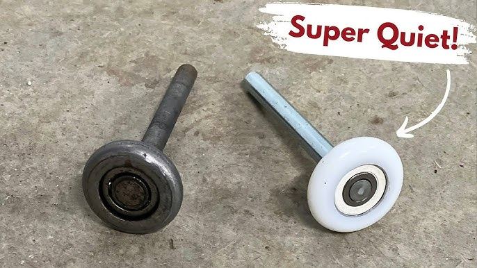 Old worn garage door roller compared to a new nylon roller