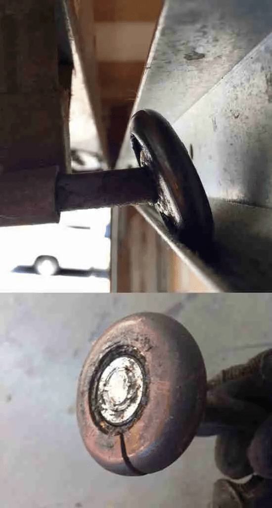 Rusted garage door roller compared to a newer roller