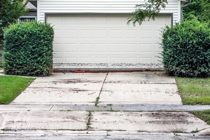 Garage door with visible water staining after flooding