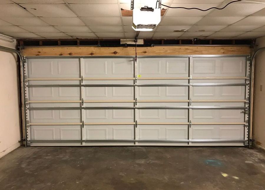 Newly installed garage door with fresh framing