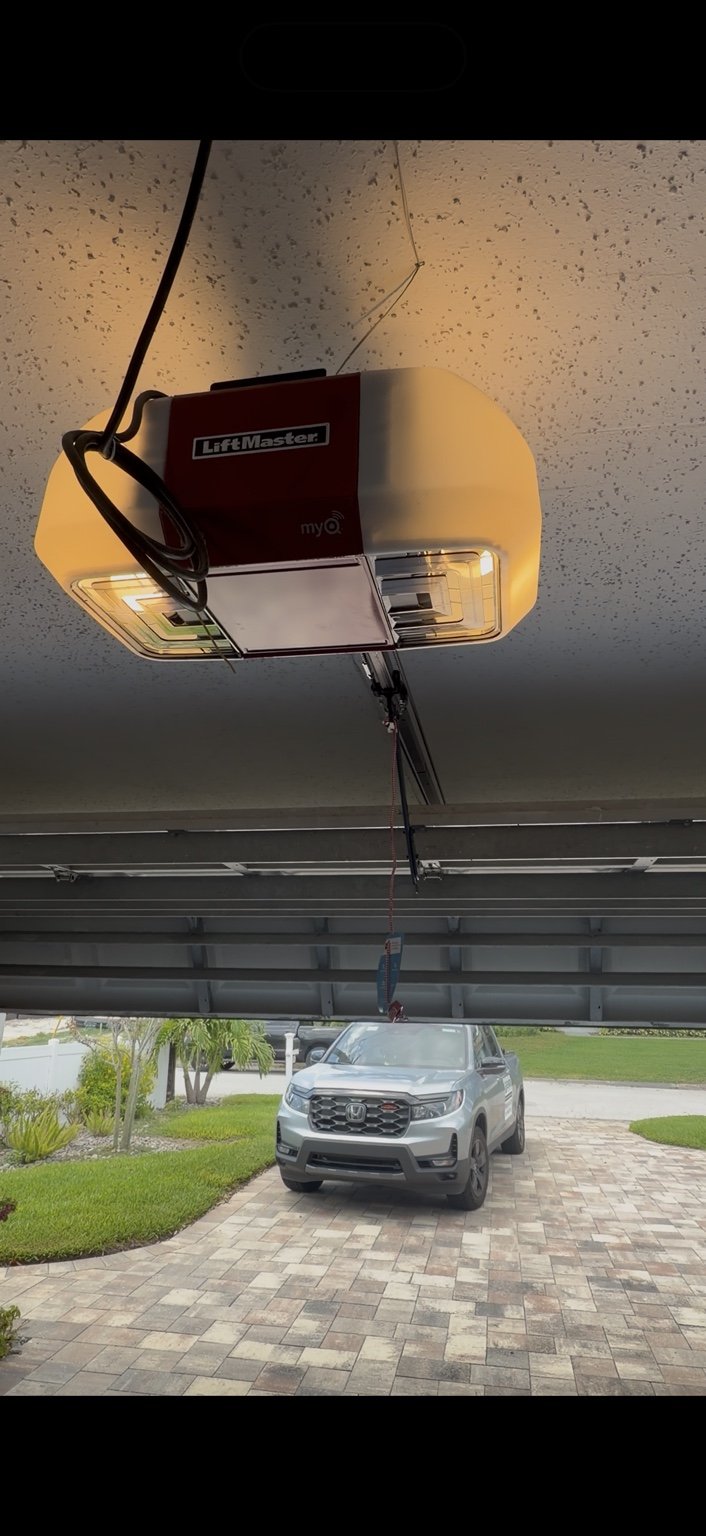 Modern Wi-Fi enabled belt drive garage door opener installed