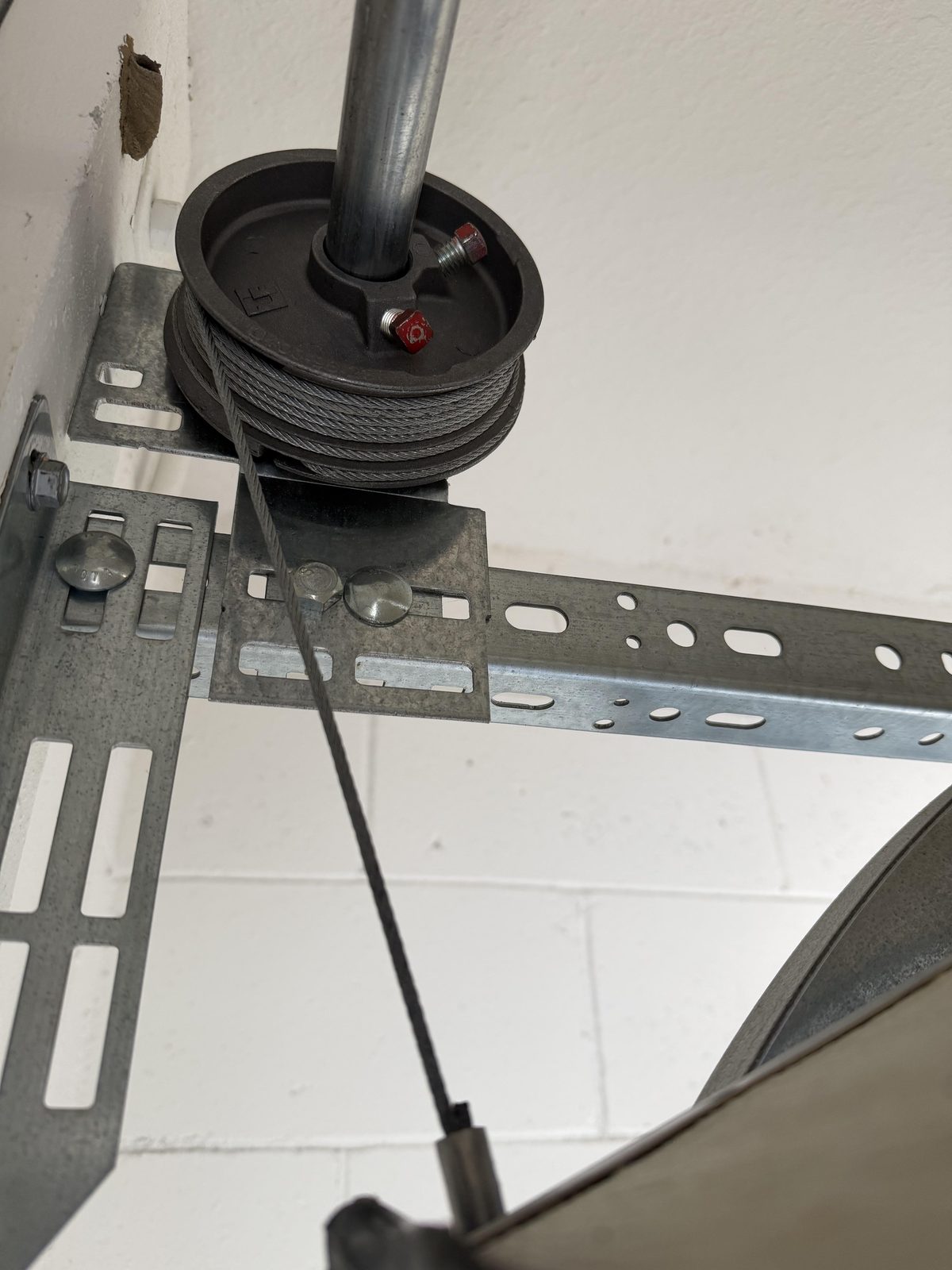Garage door cable and drum close-up