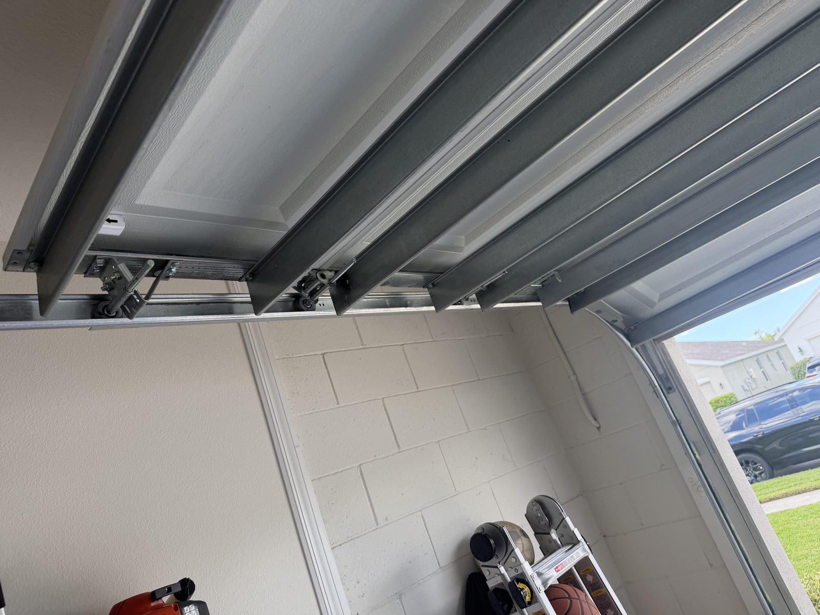 Garage door track and roller installation